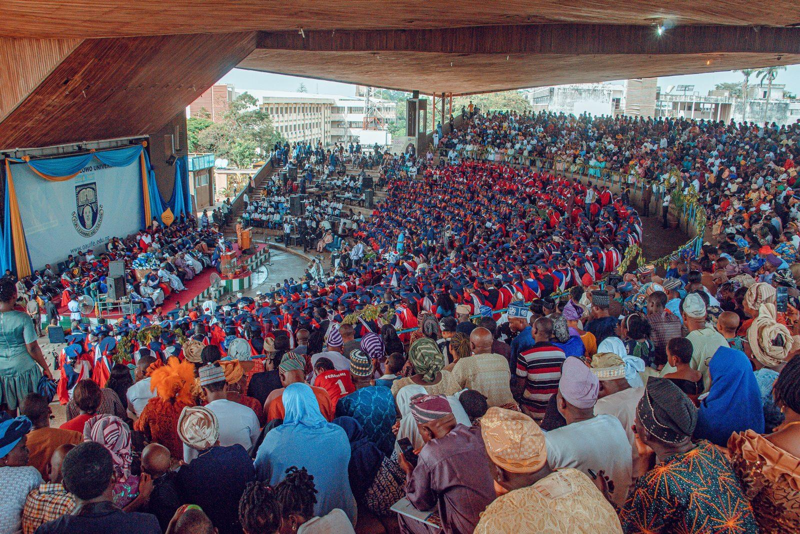 Large audience at a graduation ceremony in Ife, Nigeria, showcasing cultural diversity and academic celebration.