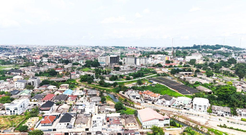 Aerial view of a sprawling city under a cloudy sky.