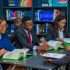 Focused group of adults studying in a library, fostering education and collaboration.