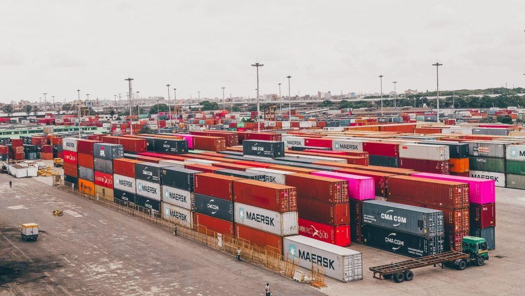 Photo by Md Sihabul Islam Colorful shipping containers stacked at a bustling port showcasing global trade.