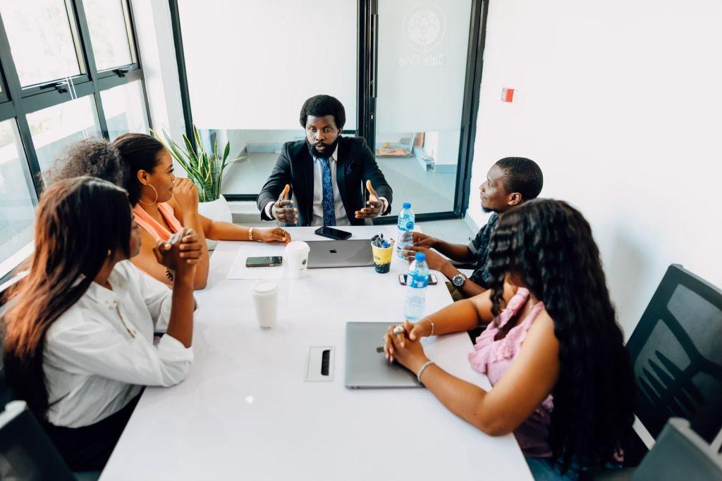 Photo by Ninthgrid Corporate team engaged in a collaborative business meeting in a modern office in Lagos, Nigeria.