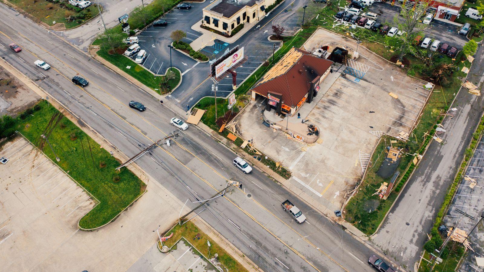 Drone view of suburb area with electricity transmission lines fell on road after strong windstorm
