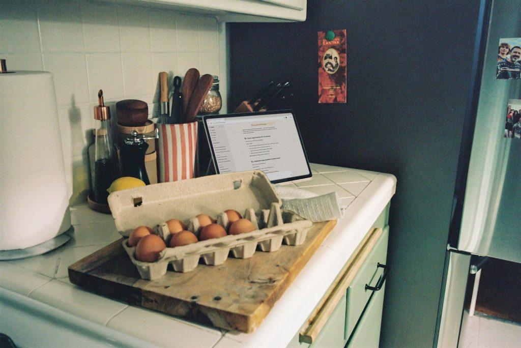 Photo by Microsoft Copilot Carton of brown eggs on a kitchen counter