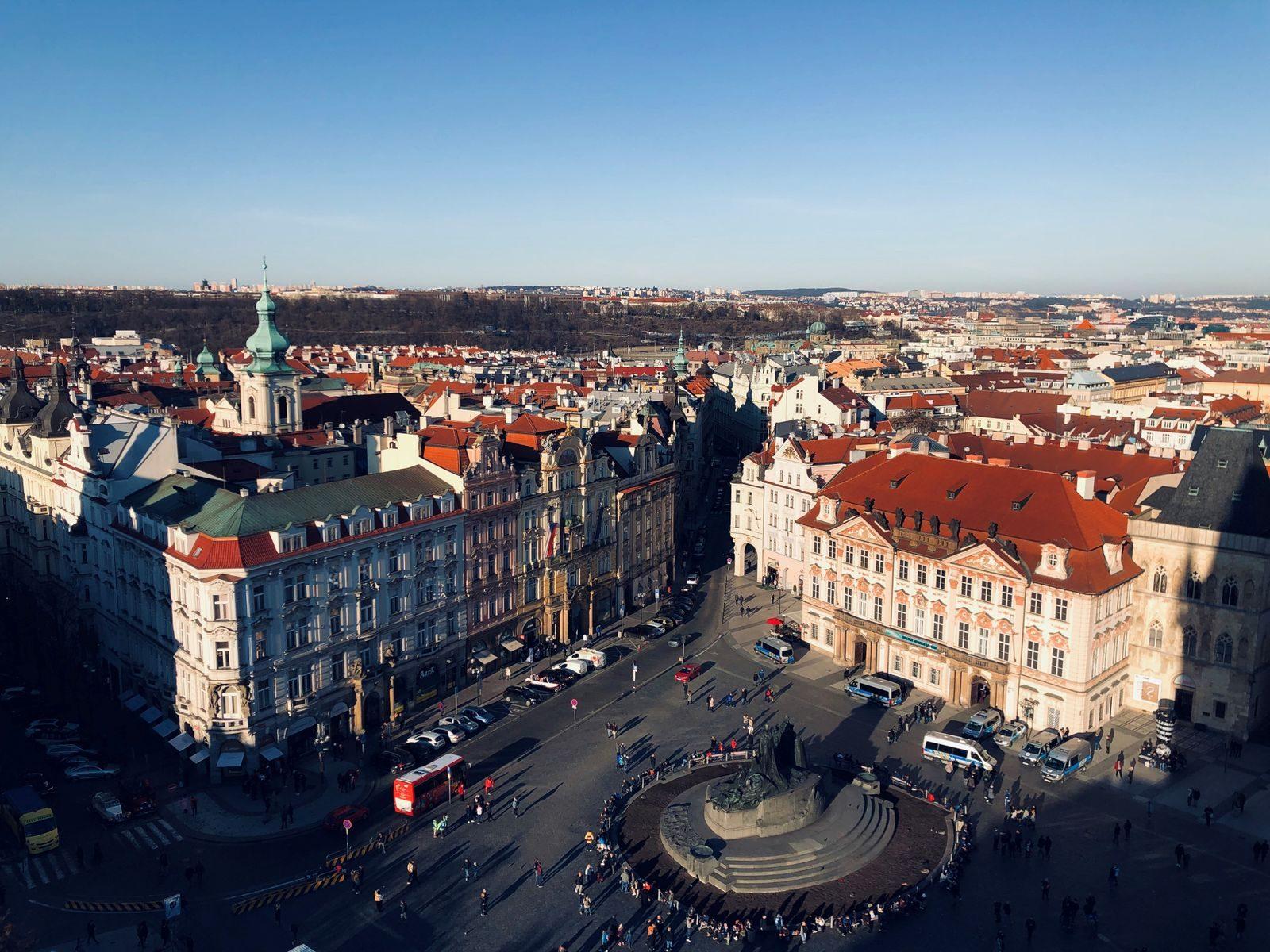 Beautiful aerial view of historic Old Town Square in Prague with stunning architecture and vibrant city life.